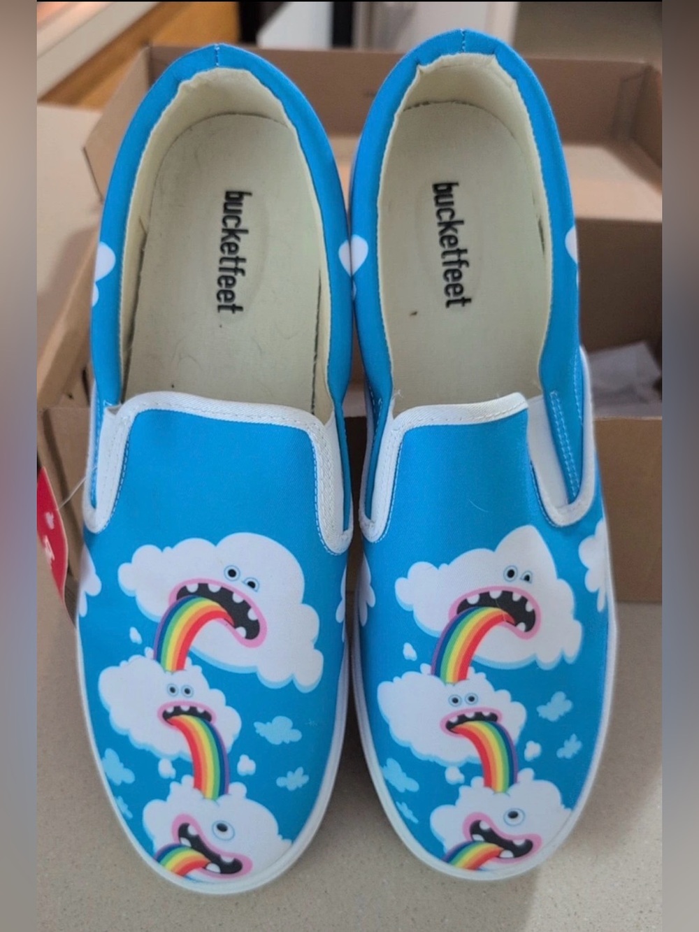 BucketFeet Blue Rainbow Cloud Slip-On Shoes 12